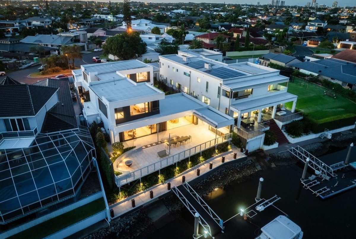 Close-up drone shot of 28 Kookaburra Court, Sorrento, showing the rear elevation, suspended terrace, and private boat pontoon