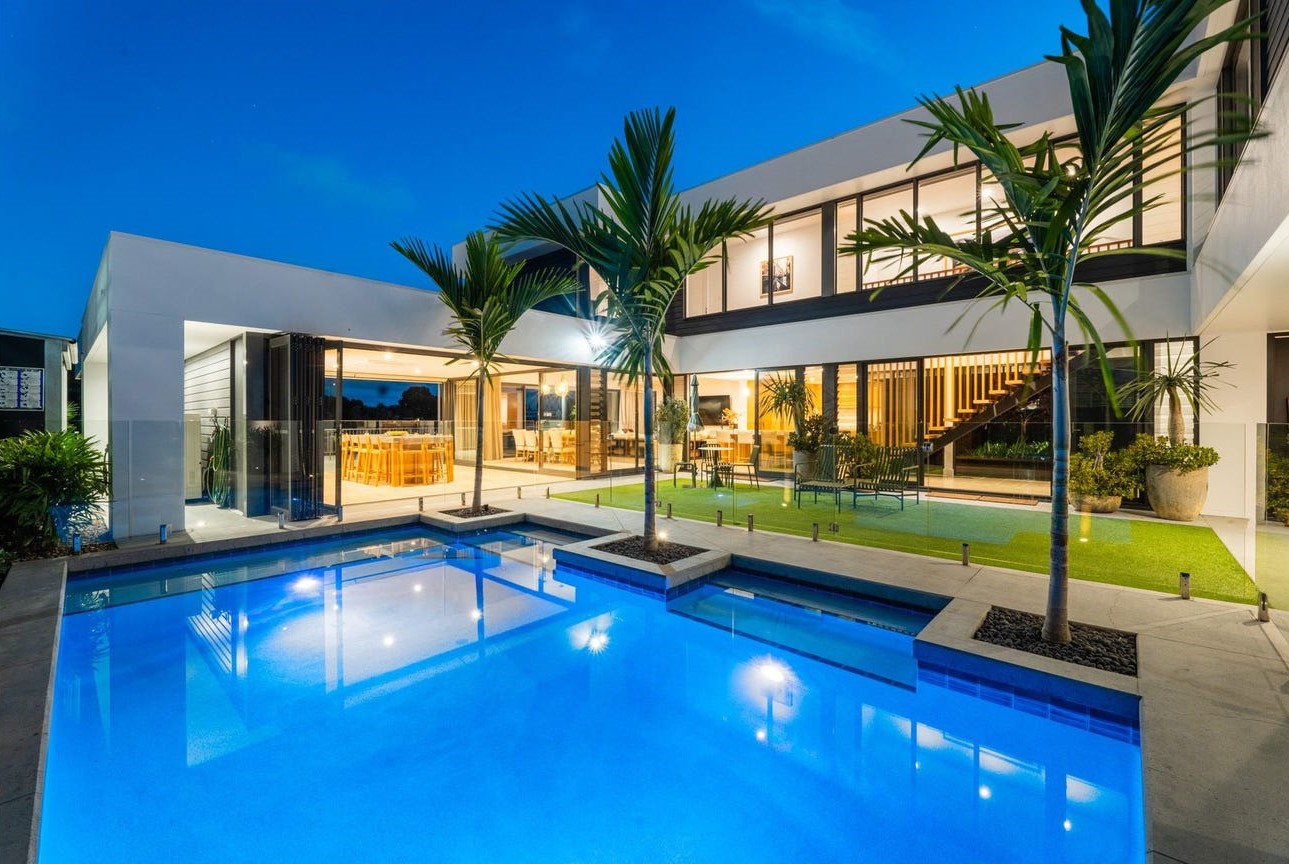 Evening view of courtyard, pool, and home at 28 Kookaburra Court, Sorrento.