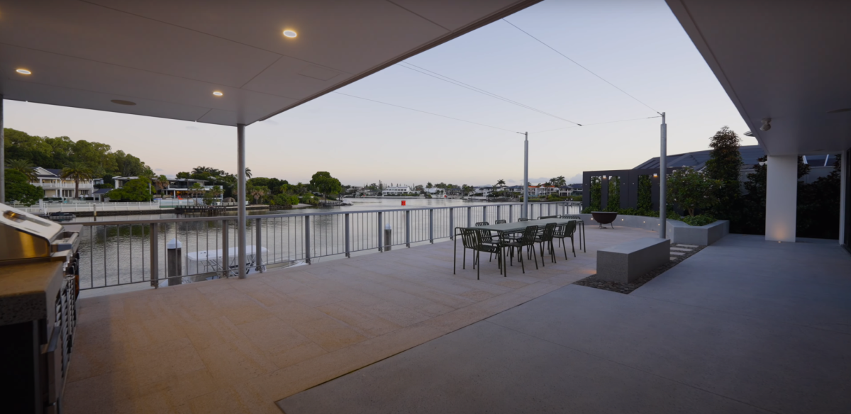 Rear terrace at 28 Kookaburra Court, Sorrento with BBQ area, outdoor seating, fire pit, and canal view