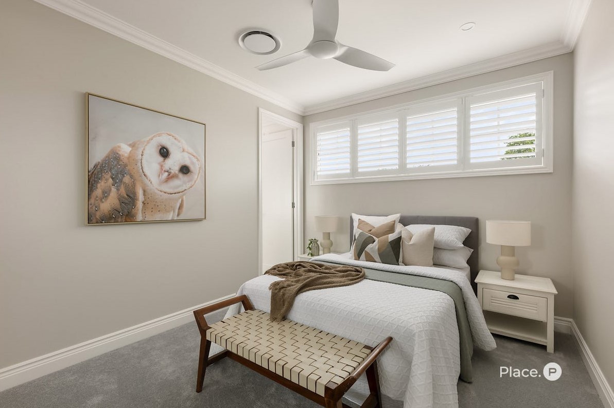 Bedroom at 63 Oateson Skyline Drive, Seven Hills, featuring carpet floors, ducted AC outlet on the ceiling, ceiling fan, double size bed, window with louvered privacy screening, and access door to the ensuite.