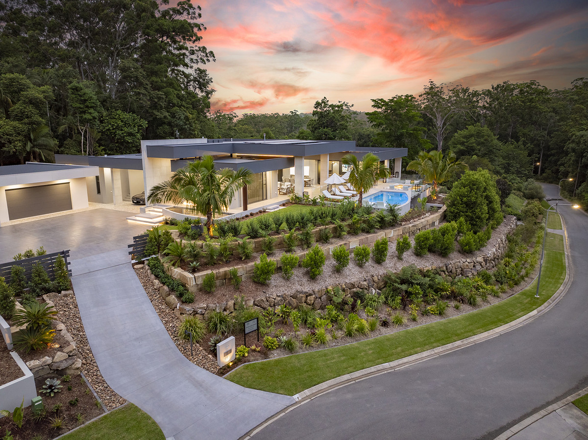 Aerial view of 74 Anning Road, Forest Glen, showcasing the property's elevated position and landscaped gardens providing privacy from the street.