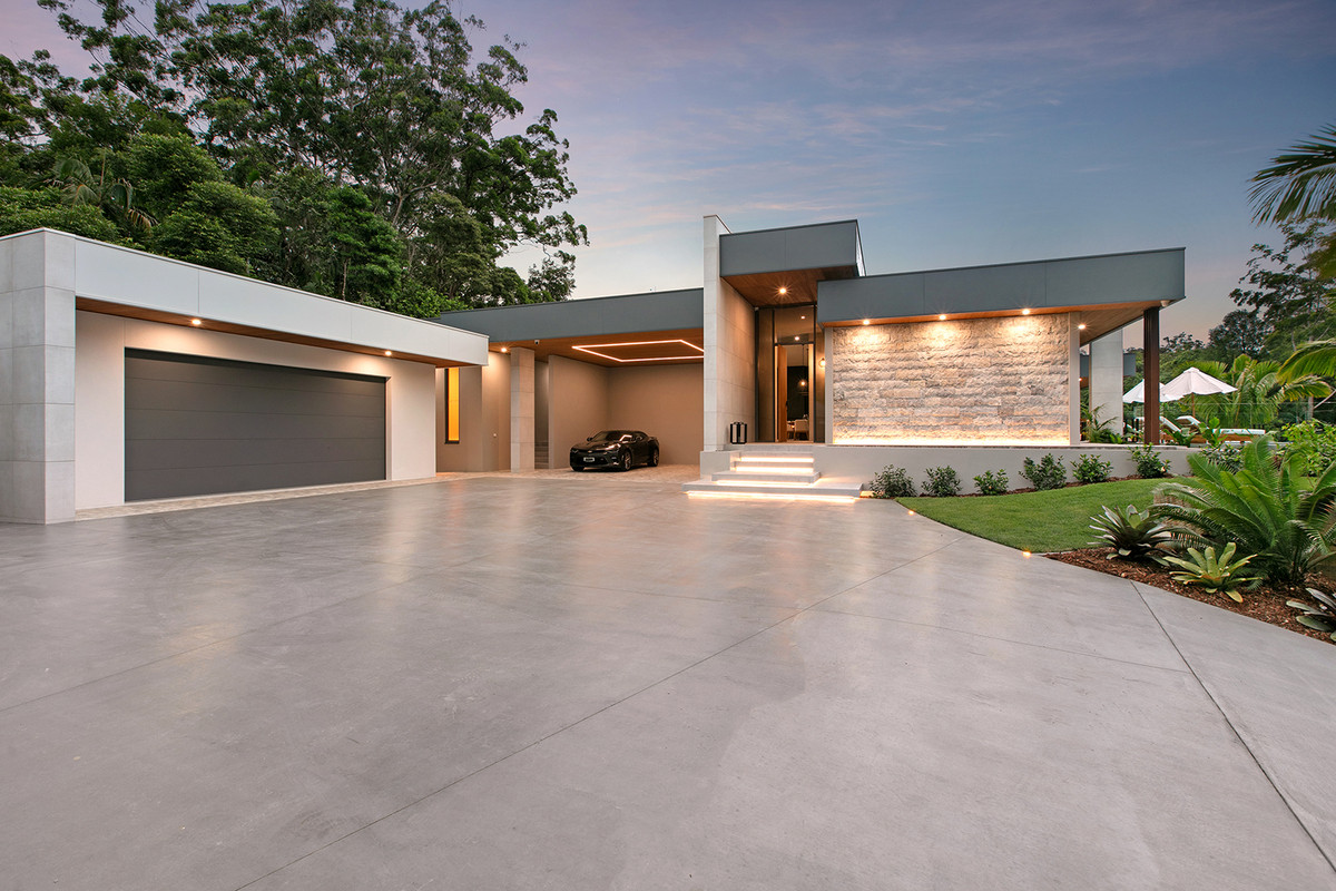 Front view of 74 Anning Road, Forest Glen, showcasing the garage, open parking, and elegant front entry.