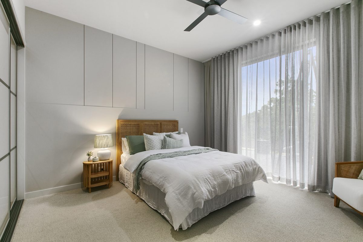 Bedroom 2 at 74 Anning Road, Forest Glen with robe doors, Balinese style furniture, and sheer curtains
