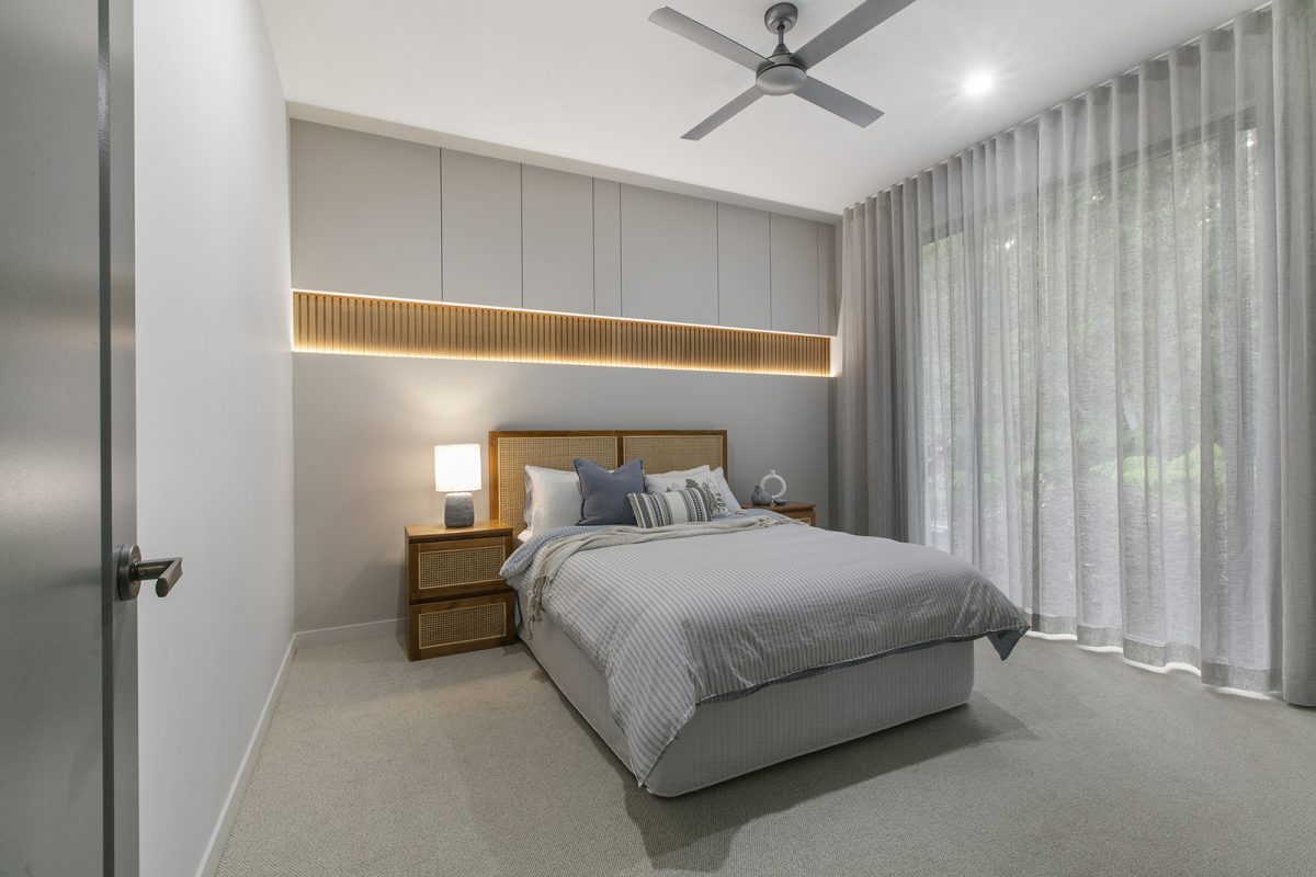 Queen size bed in Bedroom 4 at 74 Anning Road, Forest Glen with Balinese style furniture and Paulownia Hardwood Timber Slats feature