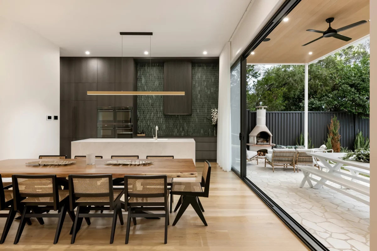 Open-plan dining area with views of the kitchen and alfresco entertaining space
